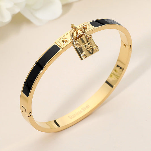 Black Stainless Steel Lock Charm Enamel Inlay Hinged Bangle Bracelet M H W ACCESSORIES LLC Black Stainless Steel Lock Charm Enamel Inlay Hinged Bangle Bracelet